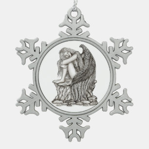 A sleeping Angel on the Stone Snowflake Pewter Christmas Ornament