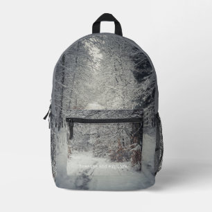 A snow-covered path through a winter forest printed backpack