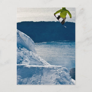 A snowboarder jumping postcard