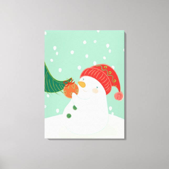 A snowman hanging an ornament on a tree canvas print (Front)