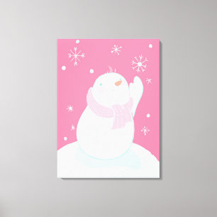 A snowman reaching for a falling snowflake canvas print