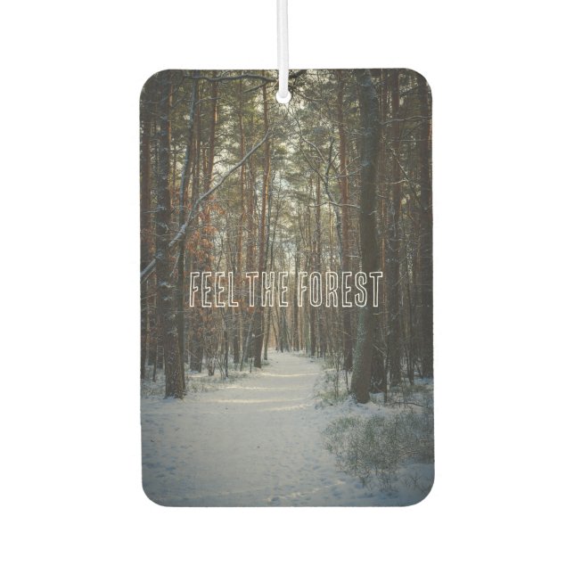 A snowy trail in a winter pine forest car air freshener (Front)
