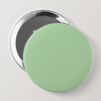 A soft pale green background fills the image 10 cm round badge