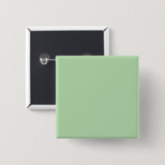A soft pale green background fills the image 15 cm square badge