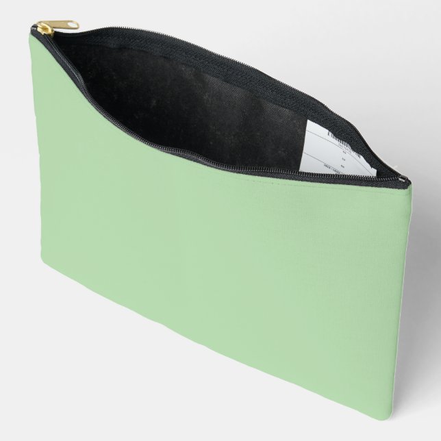 A soft pale green background fills the image accessory pouch (Open)