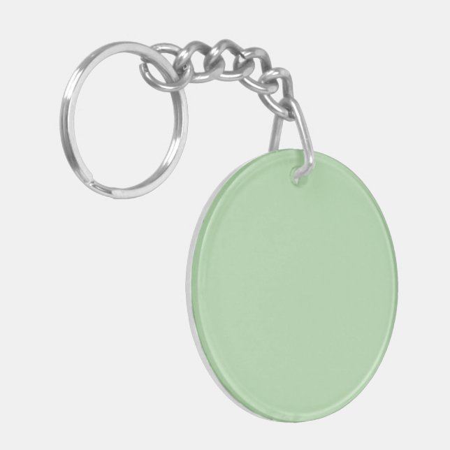 A soft pale green background fills the image key ring (Front Left)