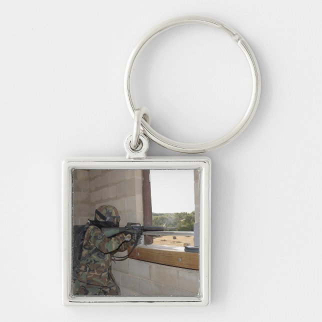 A soldier acts as an opposition force key ring (Front)
