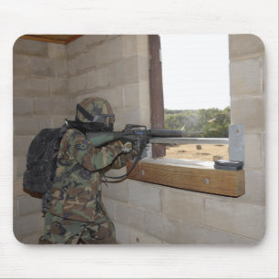 A soldier acts as an opposition force mouse mat