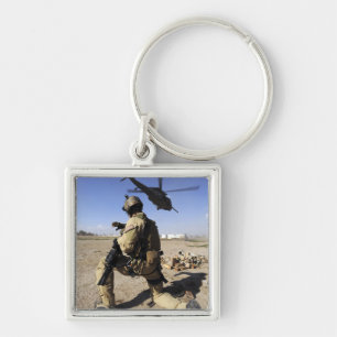 A soldier conducts security for an HH-60 Key Ring