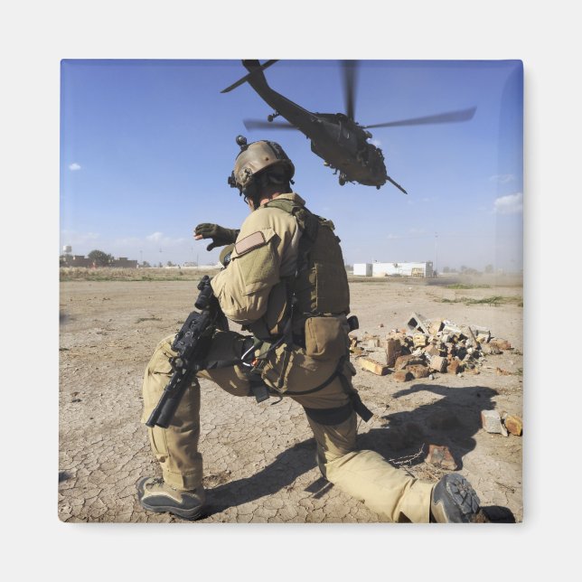 A soldier conducts security for an HH-60 Magnet (Front)