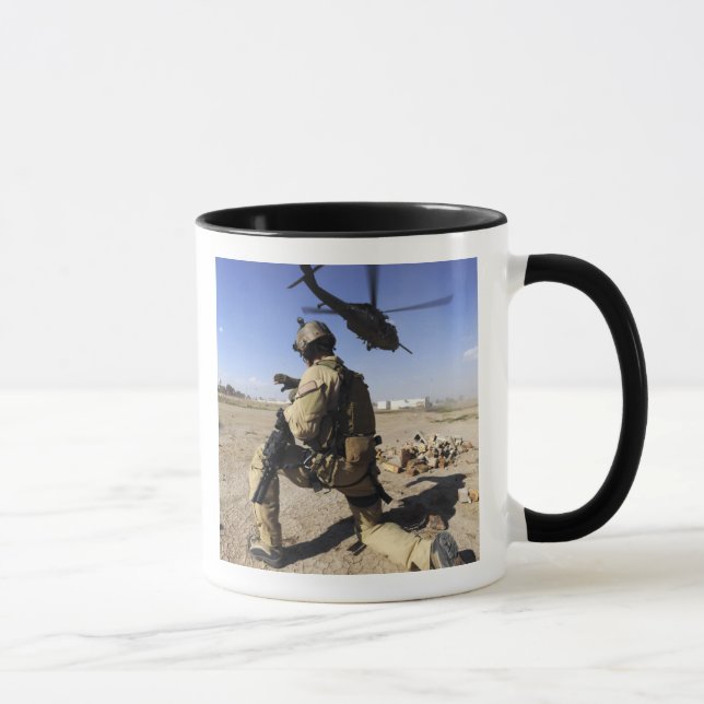 A soldier conducts security for an HH-60 Mug (Right)