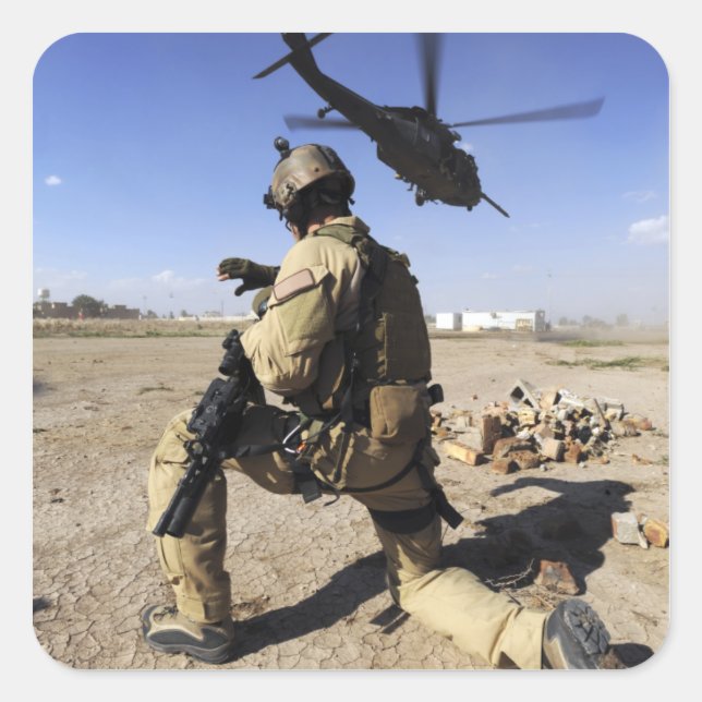 A soldier conducts security for an HH-60 Square Sticker (Front)