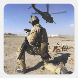 A soldier conducts security for an HH-60 Square Sticker