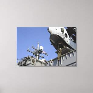 A soldier fast-ropes canvas print