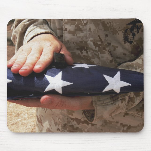 A soldier holds the United States flag Mouse Mat (Front)