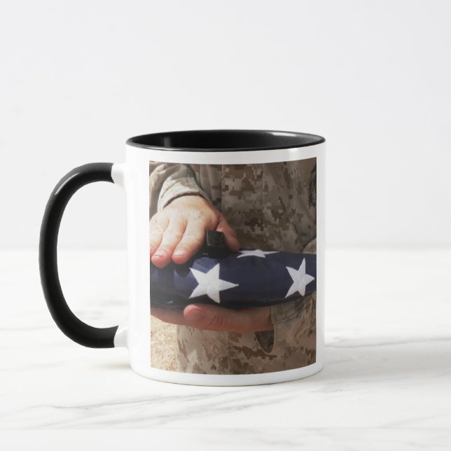 A soldier holds the United States flag Mug (Left)
