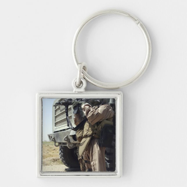 A soldier provides security for Marines Key Ring (Front)