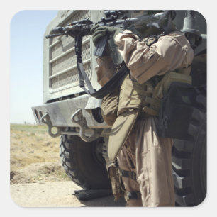 A soldier provides security for Marines Square Sticker