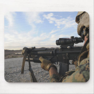 A soldier sights in to fire on a target mouse mat