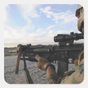 A soldier sights in to fire on a target square sticker