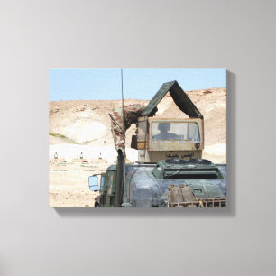 A soldiier instructs an Iraqi army soldier Canvas Print