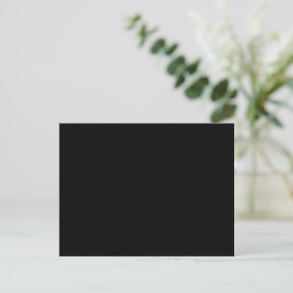 A solid black textured surface fills the entire postcard