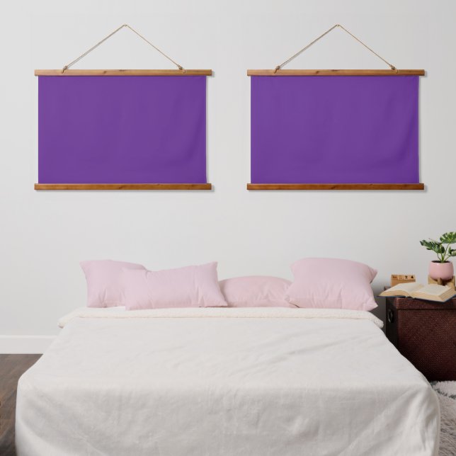 A solid purple background with a white square cent hanging tapestry (Bedroom)