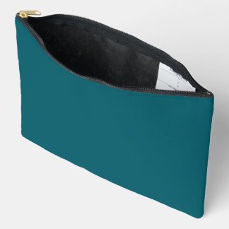 A solid teal background fills the image accessory pouch