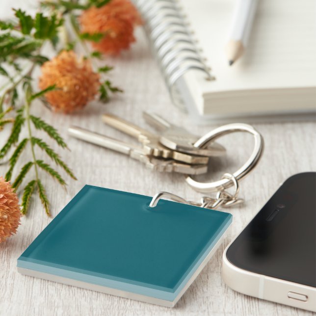 A solid teal background fills the image key ring (Front Right)