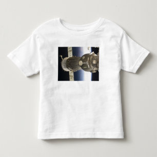 A Soyuz spacecraft backdropped by Earth Toddler T-Shirt