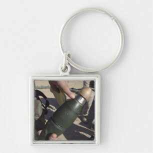 A squad leader points to a delay setting key ring