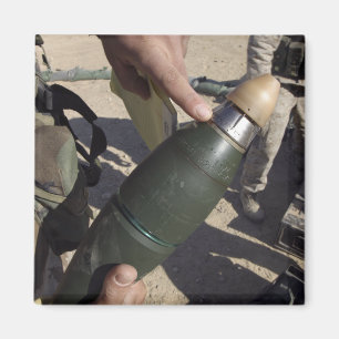 A squad leader points to a delay setting magnet