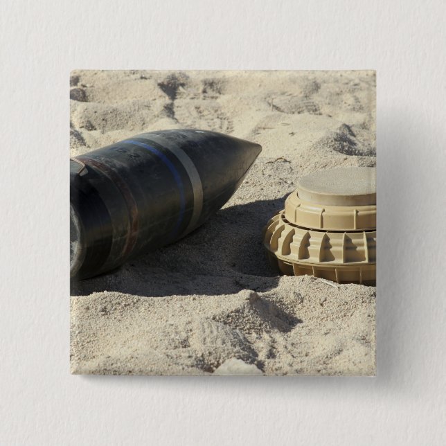 A static display of a converted ordnance shell 15 cm square badge (Front)