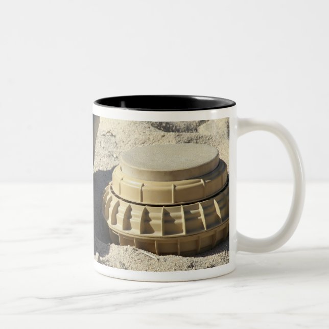 A static display of a converted ordnance shell Two-Tone coffee mug (Right)
