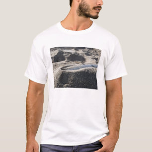 A static display of an ordnance shell T-Shirt