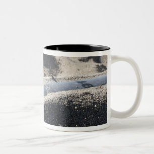 A static display of an ordnance shell Two-Tone coffee mug