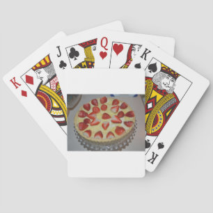 A strawberry cake playing cards