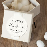 A Sweet Thank You Cream Wedding Classic Round Sticker<br><div class="desc">Chic light cream thank you sticker for your wedding reception favours featuring "A Sweet Thank You" in simple modern typography and a stylish script,  your names joined together by a heart and your wedding date.</div>