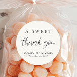 A Sweet Thank You Cream Wedding Favour Classic Round Sticker<br><div class="desc">A modern cream sticker for your wedding party favours featuring "A Sweet Thank You" in a chic script and elegant typography,  your names and wedding date.</div>