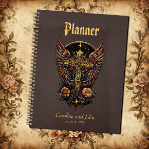 A symbol of strength: The ornate cross with wings. Planner