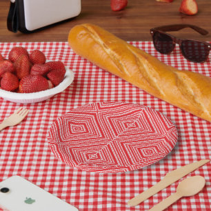 A symmetrical pattern featuring red, orange, and p paper plate