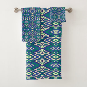 A symmetrical pattern of blue motifs on a textile  bath towel set
