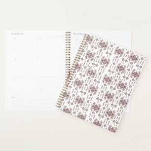A symmetrical white wrapping paper featuring a rep planner