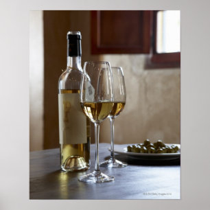 A table with bottle and two glasses of Spanish Poster