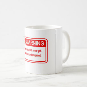 A tea cup with a funny and distinctive warning des