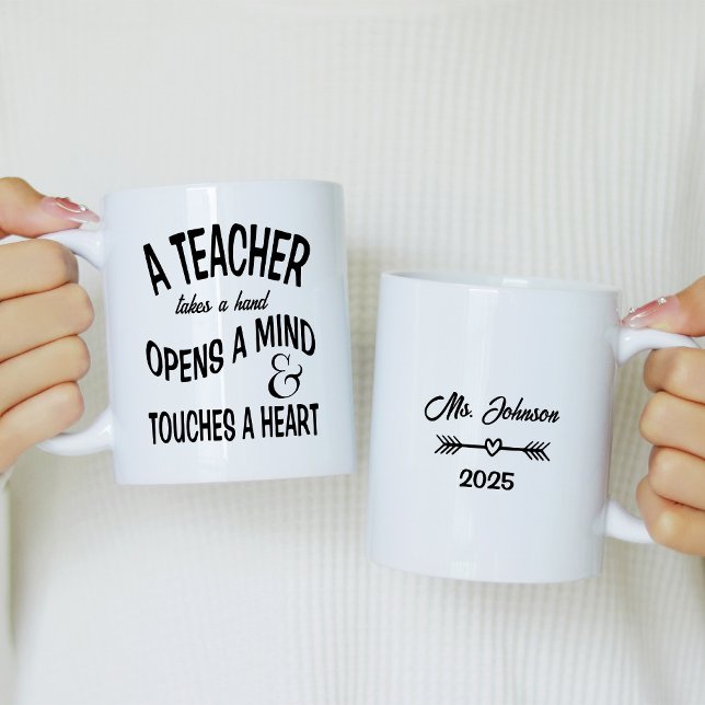 A teacher takes a hand, opens a mind coffee mug (Creator Uploaded)