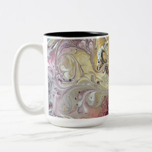 A teal and pink coffee mug