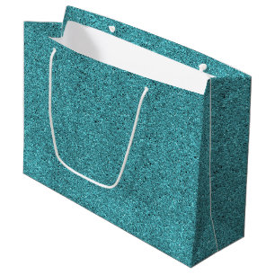 A teal gift bag with a white handle