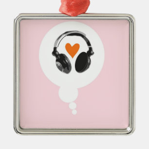 A thought bubble with a heart and headphones metal tree decoration
