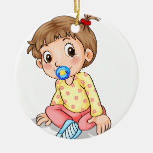 A toddler with a pacifier ceramic tree decoration